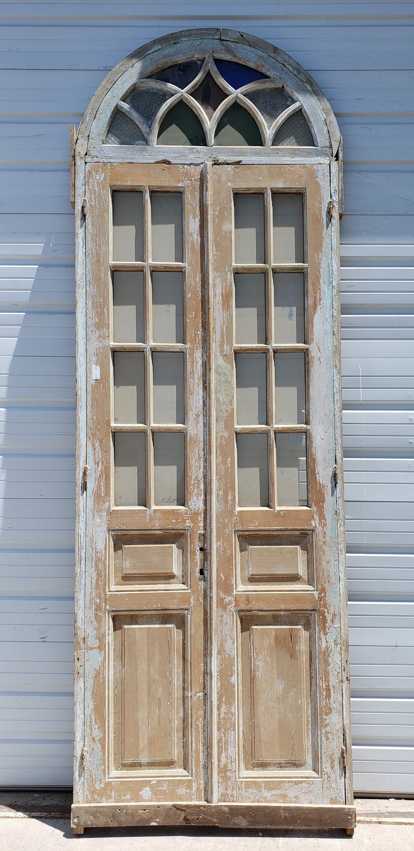 Pair of 8-Lite Wood Doors with Stained Glass Arched Transom