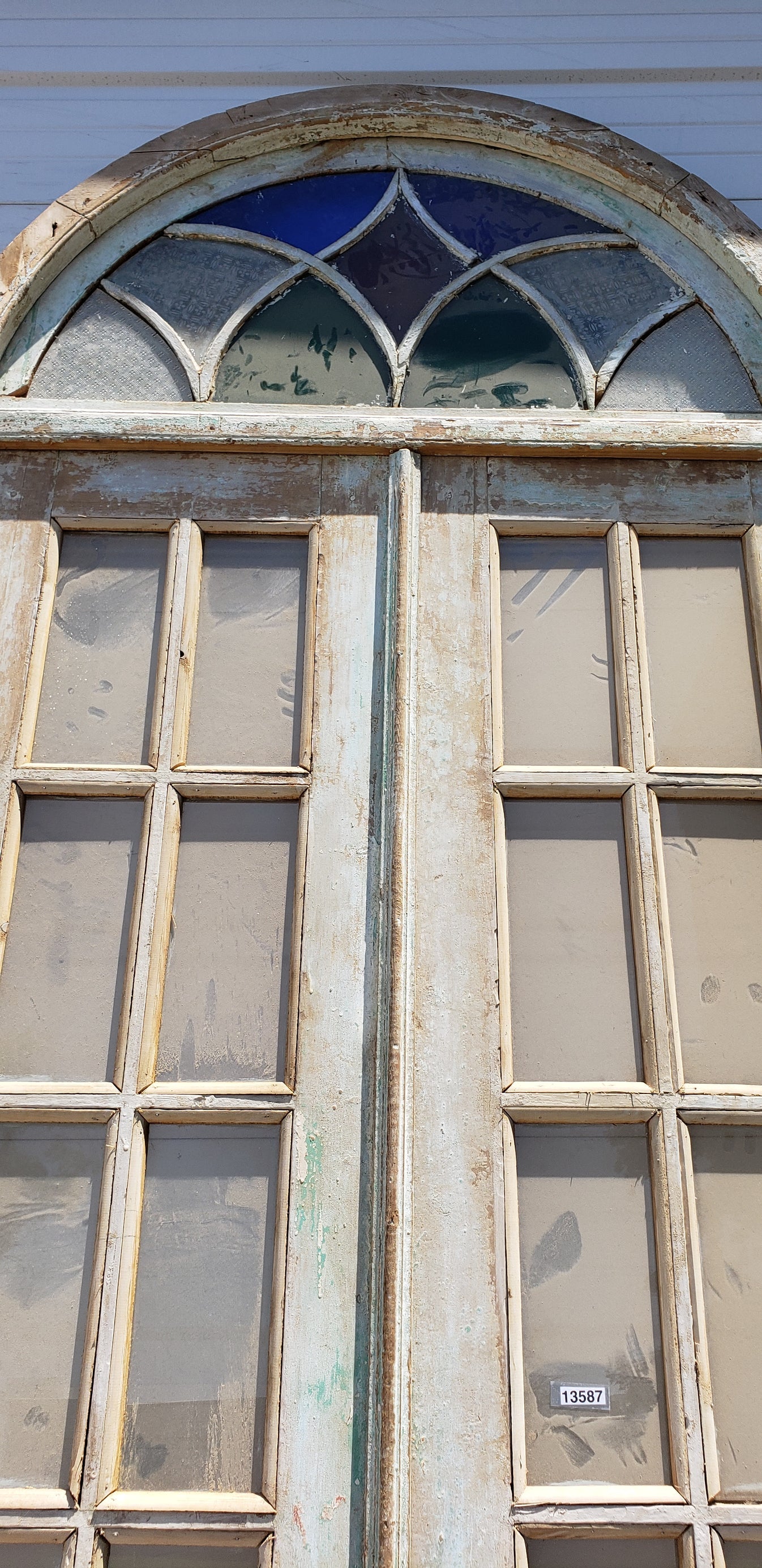 Pair of 8-Lite Wood Doors with Stained Glass Arched Transom