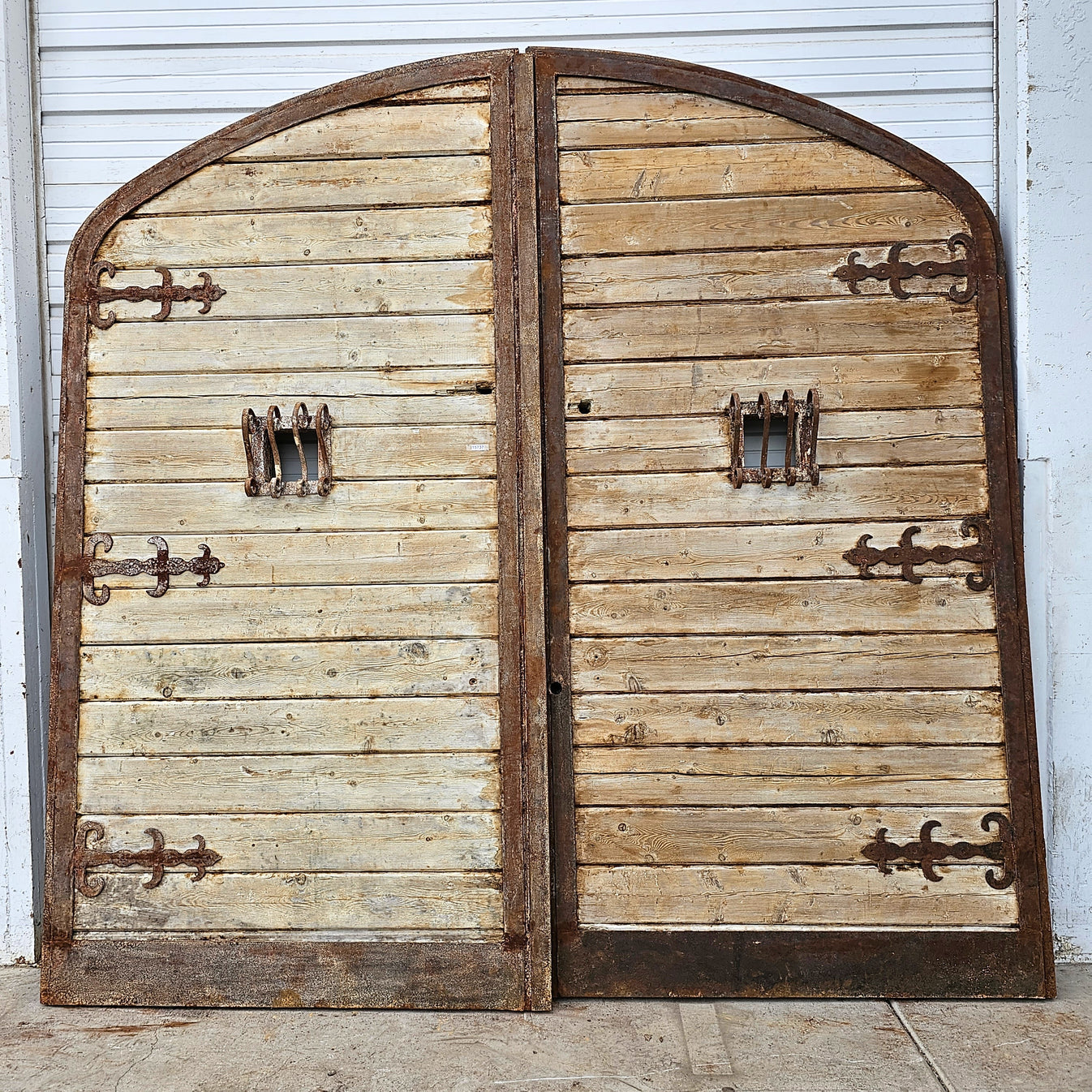 Pair of Arched Wood Doors with Iron Trim