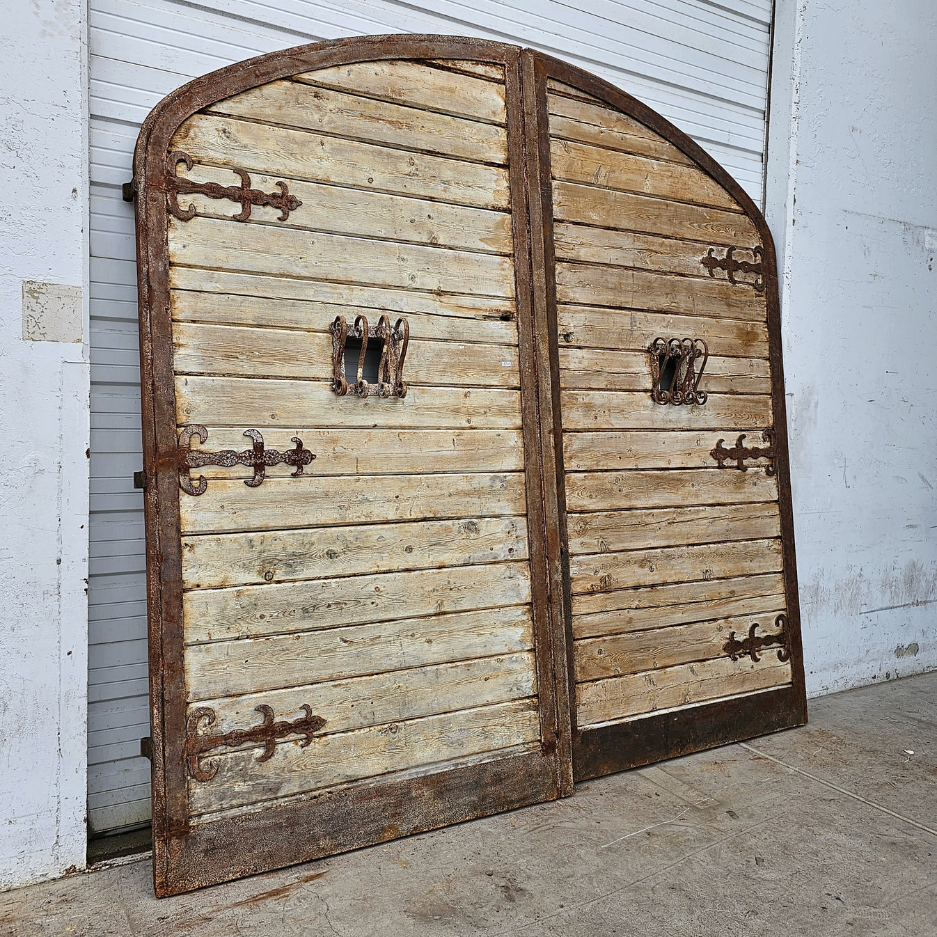 Pair of Arched Wood Doors with Iron Trim
