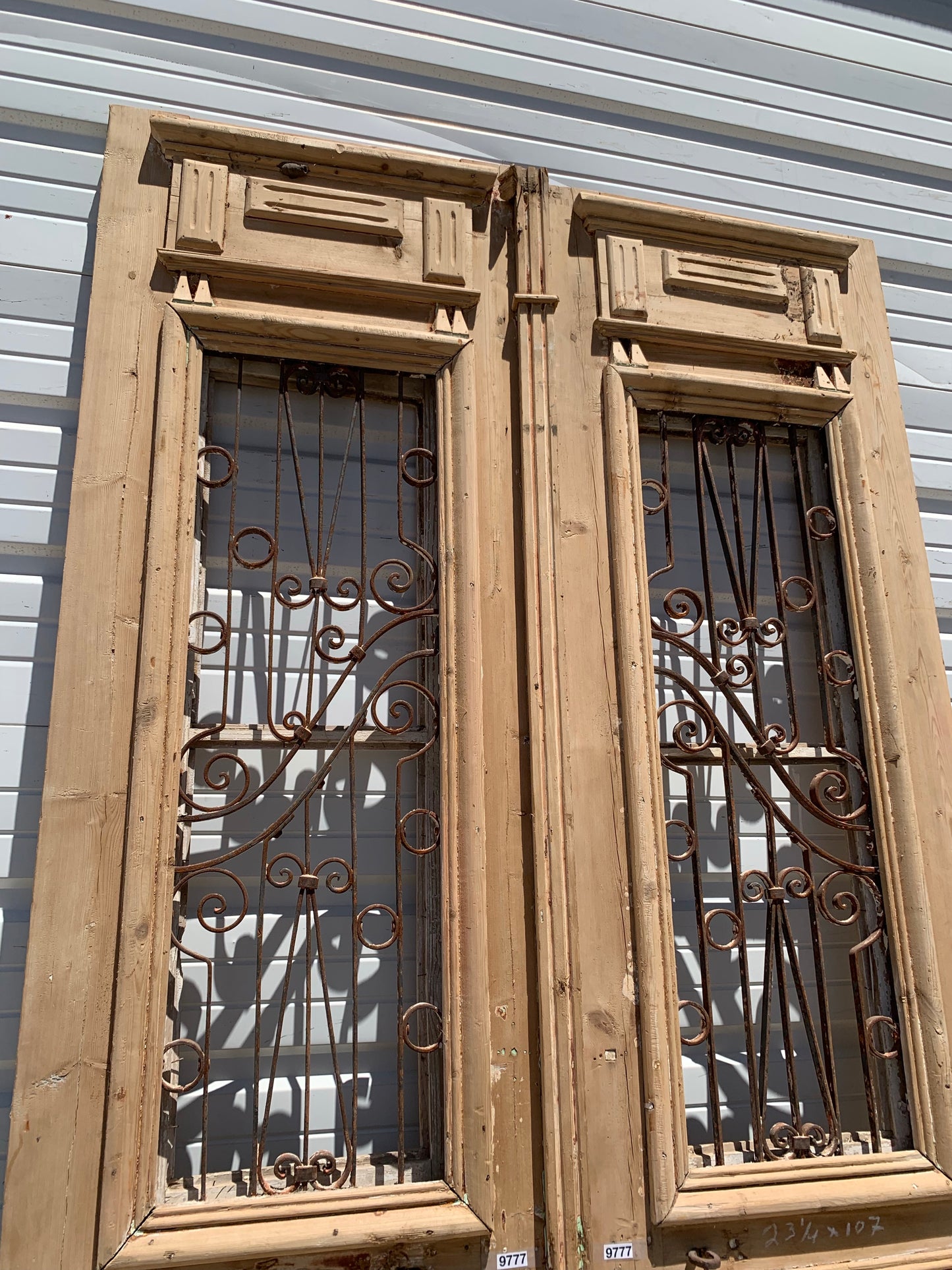 Pair of Carved Antique Doors with Iron Inserts (no glass)
