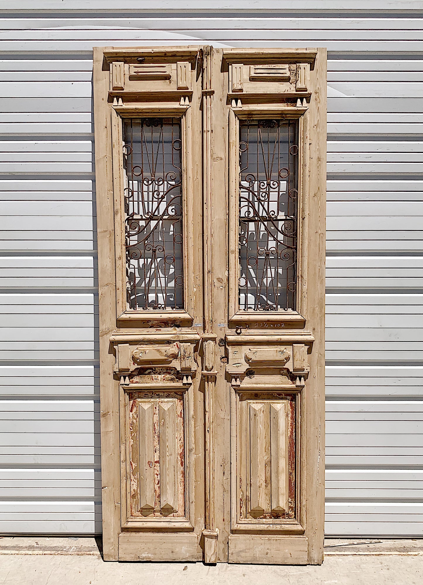 Pair of Carved Antique Doors with Iron Inserts (no glass)